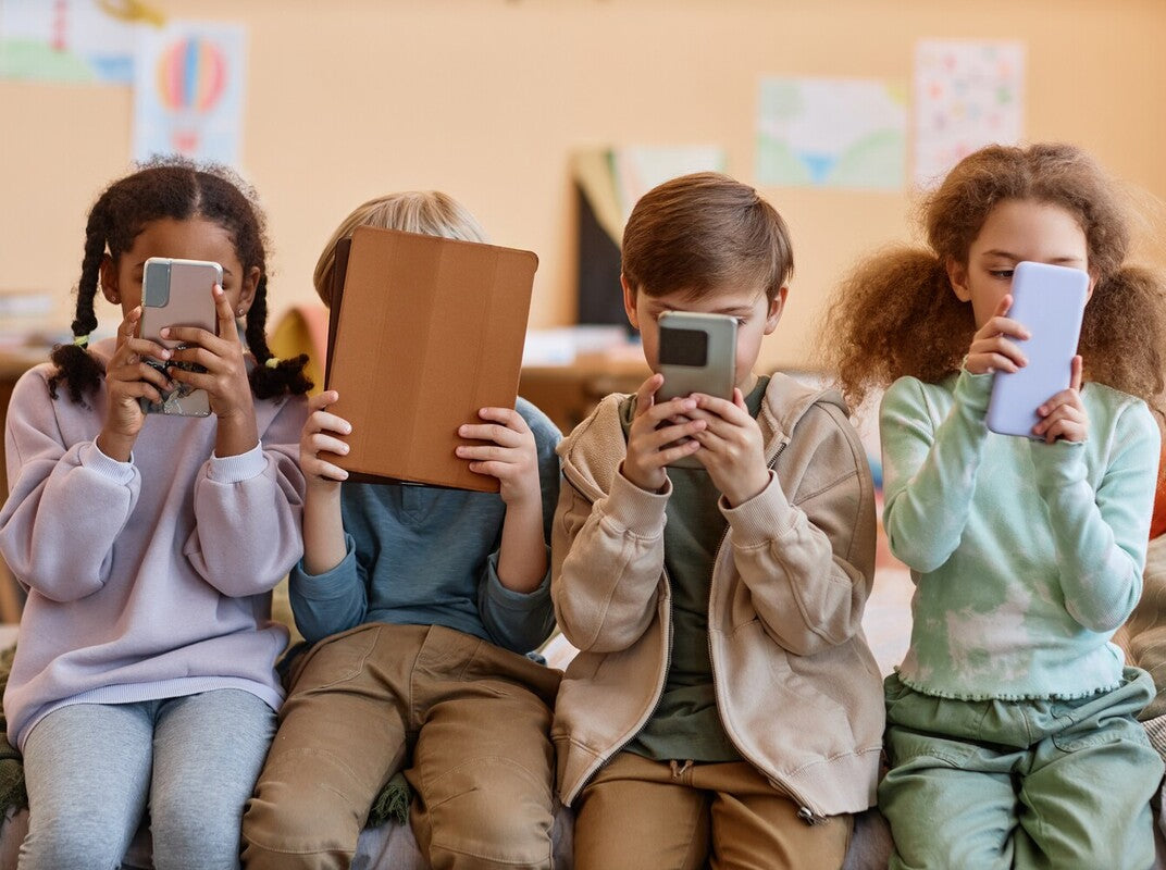 children in a classroom using the best apps for kids to improve vocabulary