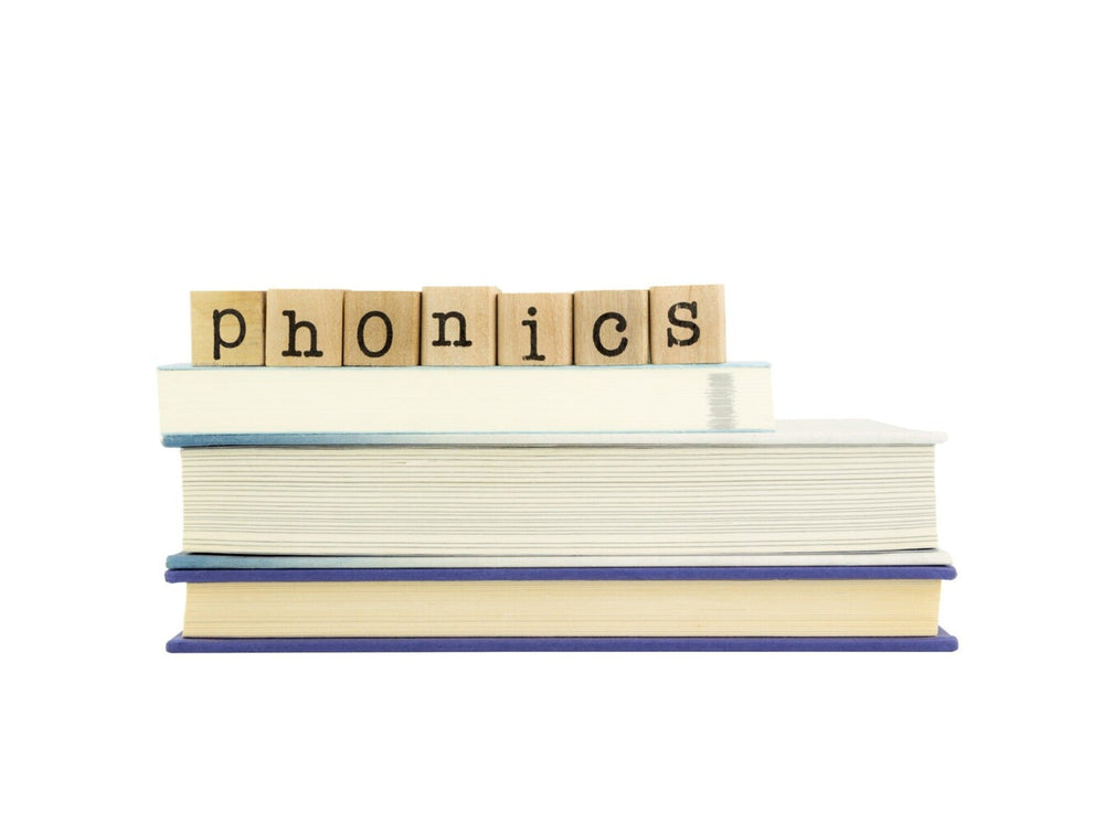books with tiles spelling the word phonics to introduce the topic of what is phonics