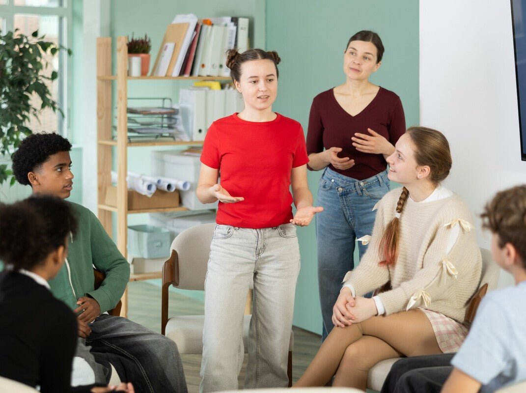 girl giving a speech in class to show what is oracy