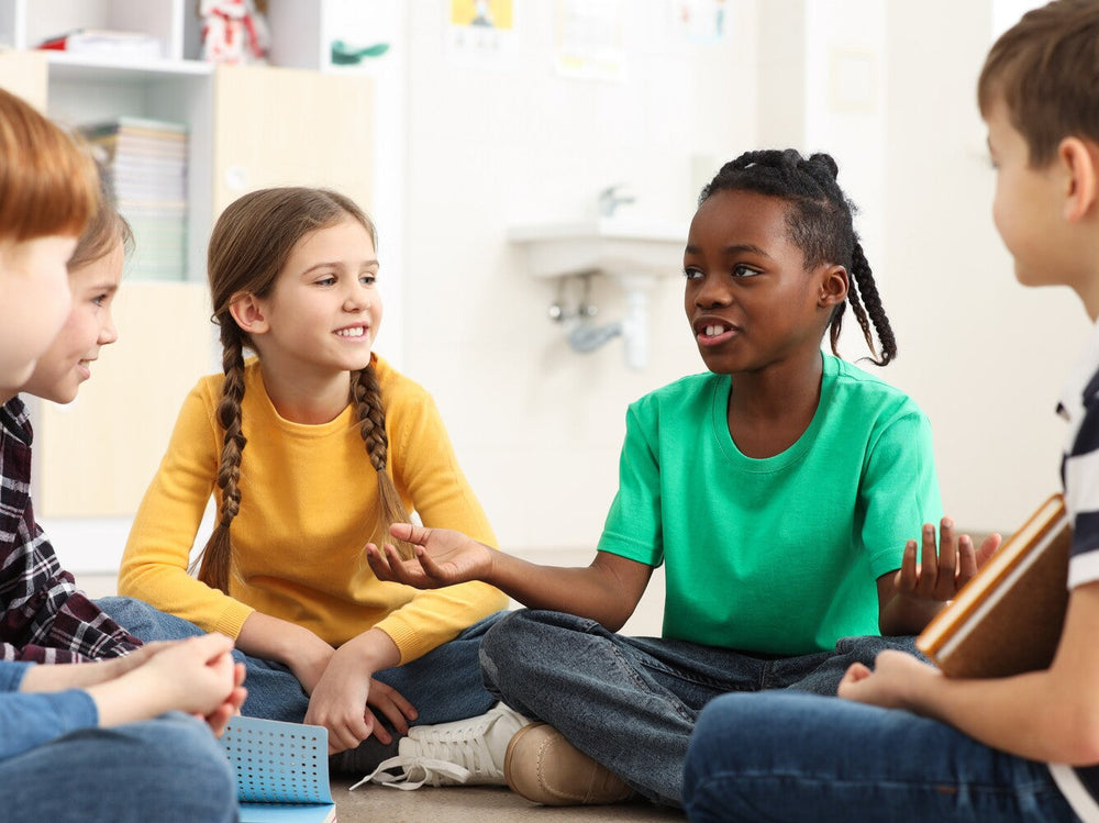 group of children speaking to show what are speaking and listening skills