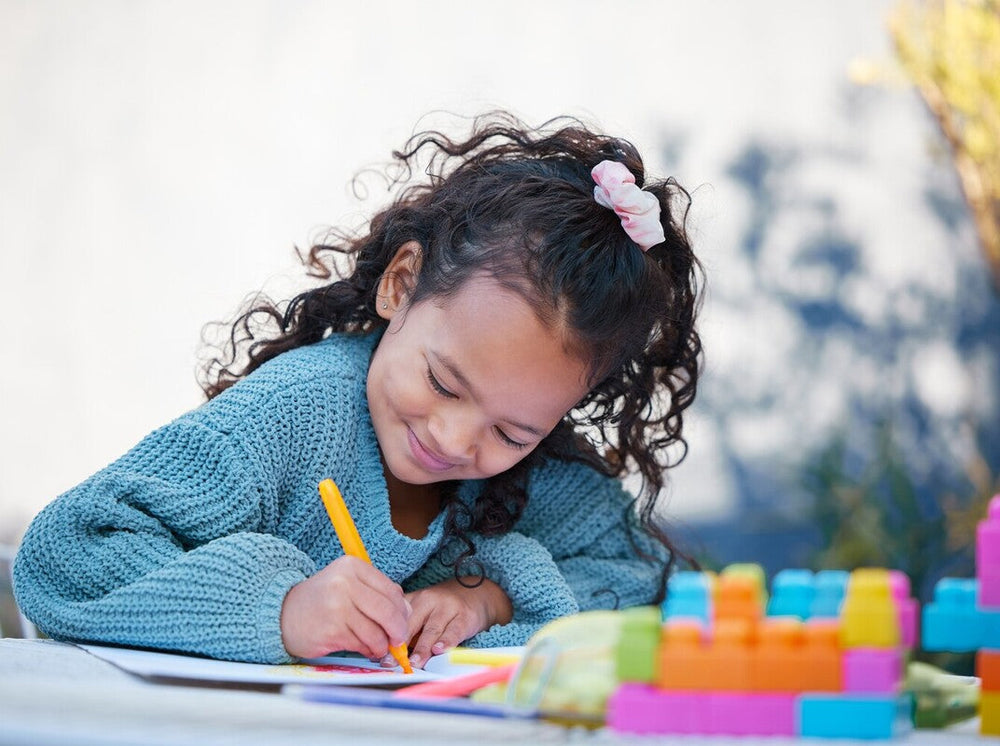young girl having fun as she does one of the best workbooks for kids