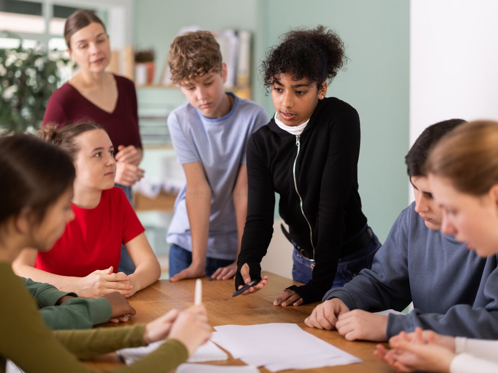 group of students doing fun public speaking games for children in debate club